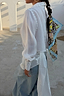 White Studded Tie Back Shirt featuring silver stud detailing and a tie-back design, styled with a printed hair scarf.