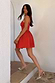 Thumbnail for Red palm broderie cotton Mini Lola Dress worn by a model walking up white stone steps.