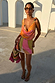 Green Abstract Leila Mini Dress with a cowl neck and multi-wear tie straps in a multi-coloured vacation print.