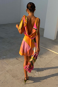 Green Abstract Leila Mini Dress with a draped cowl back and adjustable tie straps in a vibrant multi-tone print.