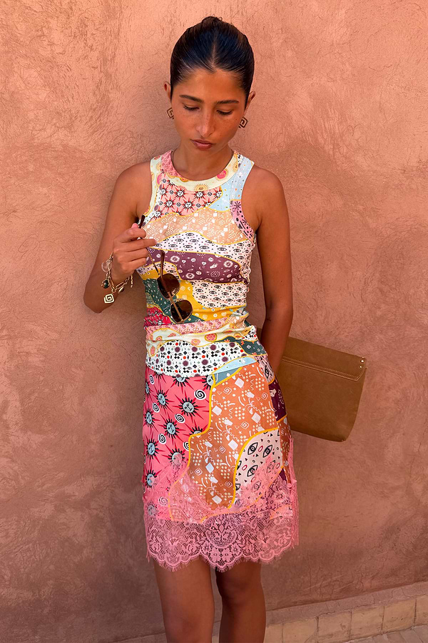 Pastel Morocco Mini Maeva Skirt featuring a pink lace trim and abstract motifs, styled with a matching tank top.