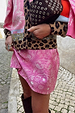 Pink Bandana Mini Dorris Skirt featuring a white paisley print, styled with a leopard print cardigan on a cobbled street.