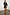 Thumbnail for Black Plisse Mini Tilly Dress with gold metallic dots and an off-the-shoulder silhouette on a model.