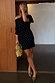 Black Plisse Mini Tilly Dress with gold metallic dots and an off-the-shoulder silhouette with lettuce trims.