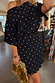 Black Plisse Mini Tilly Dress with gold metallic dots and an off-the-shoulder neckline.