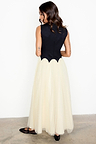 Black and Cream Monika Dress with a scalloped bodice and pleated tulle mesh skirt, shown from the back.