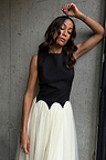 Black and Cream Monika Dress with a panelled corset top and pleated tulle mesh skirt on a model.