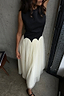 Black and Cream Monika Dress featuring a sleeveless corset top and a pleated tulle mesh midi skirt.