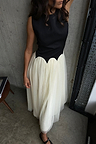 Black and Cream Monika Dress featuring a sleeveless corset top and a pleated tulle mesh midi skirt.