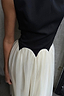 Thumbnail for Black and Cream Monika Dress with a corset-style top and pleated tulle mesh skirt with scalloped edging.
