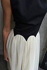 Black and Cream Monika Dress with a corset-style top and pleated tulle mesh skirt with scalloped edging.