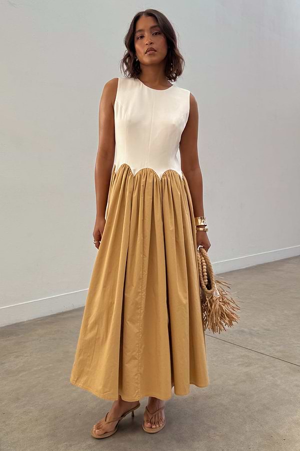 Camel Monika Dress with a panelled cream corset top, scalloped hem and a camel pleated cotton skirt.