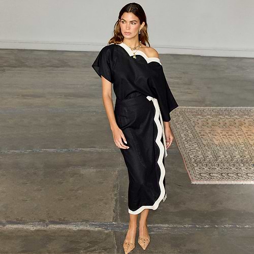 Black Mono Scallop Jaspre Skirt with white scallop trim and wrap tie, styled with a matching off-the-shoulder top.