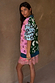 Morocco Martha Knit Cardigan with colourful sun and eye motifs, layered over a pink lace slip dress.