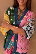 Morocco Martha Knit Cardigan featuring a multi-coloured sun, eye and snake print with contrast blue hems.