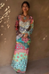 Pastel Morocco Mesh Vivi Dress featuring sun and eye motifs, long sleeves and a sheer multi-wear mesh fabric.