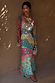 Pastel Morocco Mesh Dress with multi-coloured sun and eye motifs, long sleeves and V-neckline.