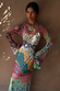 Multi-wear Pastel Morocco Mesh Vivi Dress with colourful sun and eye motifs and flared sleeves, worn by a model.