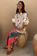 Morocco Charms Marley Shirt in cream with red hearts and sun motifs, worn with a vibrant printed maxi skirt.