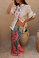 Pastel Morocco Dorris Skirt featuring a multi-colour sun print and snake motifs, paired with a matching shirt.
