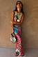 Pastel Morocco Dorris Skirt featuring eye and snake motifs, paired with a co-ord top and woven accessories.