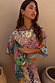 Pastel Morocco Tilly Dress in a multi-coloured metallic fleck print with iconic sun motifs and voluminous sleeves.