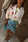 Multi-wear Morocco Mini Wrap Skirt with blue and green sun prints and side-tie fastening, perfect for dopamine dressing.
