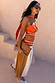 Multi Stripe Bea Dress in orange and blue featuring a pleated polka dot skirt and matching multi-wear neck scarf.