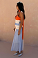 Multi Stripe Bea Dress in an orange and blue colourway with a pleated polka dot skirt and matching neck scarf.