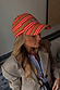 Multi Stripe Cap in tan brown with red stripes and baby blue NFD embroidery, styled with a checked blazer.