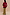Thumbnail for Mystical Martha Cardigan with embroidered motifs on a red back and contrast sleeves, styled with a matching patterned skirt.