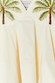 Ivory Palm Nara Top in cream cotton featuring iconic green embroidered palm motifs and a V-neckline.