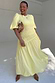 Butter yellow Nara midaxi dress with a shirred front and puff sleeves, showcasing curve fashion and inclusive sizing.