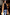 Thumbnail for Navy Book The Flight Jumper with red text, styled with a tan trench coat and blue striped trousers for a London look.