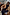 Thumbnail for Navy Book The Flight Jumper with red text, layered with a tan studded trench and pinstripe trousers.