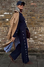 Thumbnail for Navy Studded Knit Jogger co-ord with silver stud details, layered under a tan trench coat.