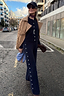 Thumbnail for Navy Studded Knit Jogger with silver stud details, styled as a co-ord with a camel trench for a London street look.