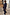 Thumbnail for Navy Pinstripe Arden Trousers and matching blazer with sun and eye embroidery, styled with silver trainers.