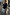 Thumbnail for Navy Knit Jumper Dress with a blue stripe cotton skirt, styled with a brown beret on a cobblestone street.