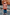 Thumbnail for NFD Kids Diamond Bomber in a rust orange knit with a bold diamond pattern, worn by a child on a London street.