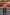 Thumbnail for NFD Kids Diamond Bomber in rust orange with a diamond pattern, worn with a floral beret and denim flares.