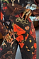 Thumbnail for Night Garden Barrel Jeans in black denim with red poppy and gold snake motifs in a relaxed barrel leg.