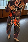 Night Garden Barrel Jeans in black featuring leopard and poppy motifs, styled with leopard print pointed heels.