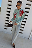 Thumbnail for Soft blue Octopus Cardigan with red embroidered motifs and contrast blanket stitching, paired with light jeans.