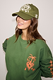 Olive Amara Cap in olive green cotton with a white embroidered heart and floral motif on the front.