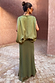Olive Wrap Jojo Midi Skirt in tonal khaki with matte and satin panels, shown from the back with a matching top.