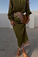 Olive green satin Lily Skirt with pink lace detailing at the waist and hem, styled with a matching blouse.