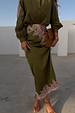 Olive green satin Lily Skirt with pink lace detailing at the waist and hem, styled with a matching blouse.