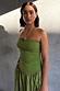 Olive Lola Mid-axi Dress with a strapless ruched bodice and gathered skirt, styled with layered gold necklaces.