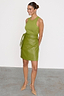 Thumbnail for Model wearing an Olive Green Vegan Leather Mini Jaspre Skirt with a tonal tank top and tan kitten heels.